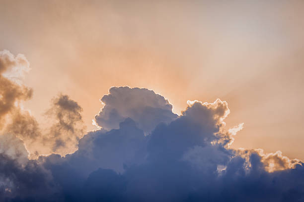 istock Sunbeams and stormy clouds 499121510