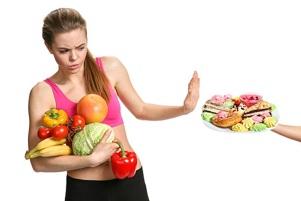 istock Beautiful girl on a white background chooses vegetables 499123244