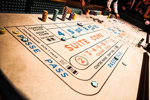 Craps Table and People Gambling all Around stock photo