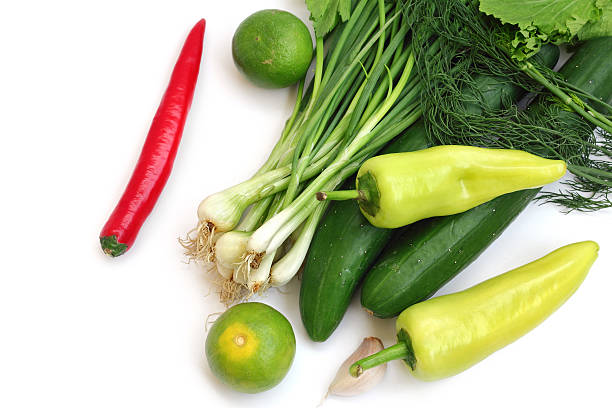 istock fresh green vegetables and chilli on white background 499124341