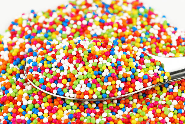 istock Colorful candy confetti on the white background 499124347