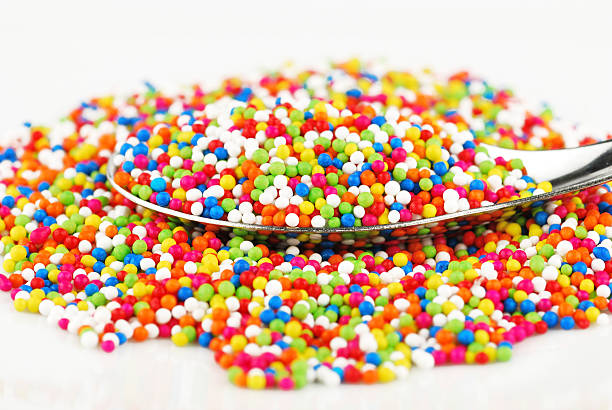 istock Colorful candy confetti on the white background 499124367