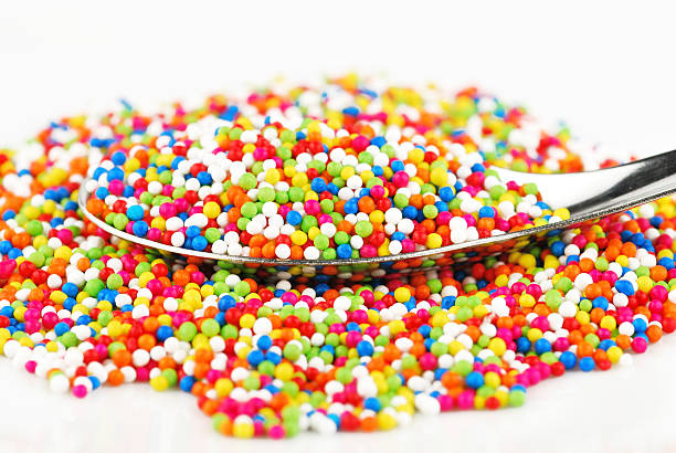 istock Colorful candy confetti on the white background 499124405