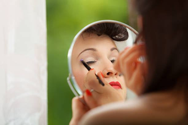 istock Girl applying make up with brush 499124646