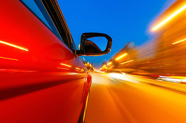 istock car driving on a motorway at high speeds 499124825