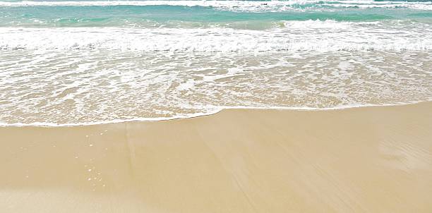 white clean sand beach background stock photo