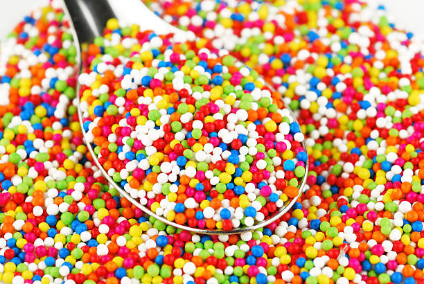 istock Colorful candy confetti on the white background 499125083