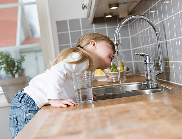 Small Girl drinking water stock photo