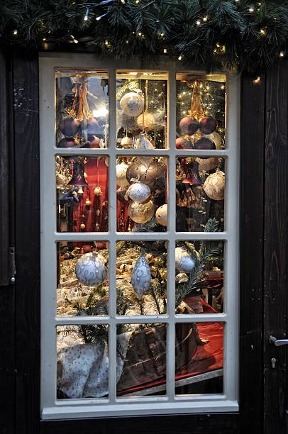 istock Christmas decorations framed in window on sale in Cologne, Germany 499126404