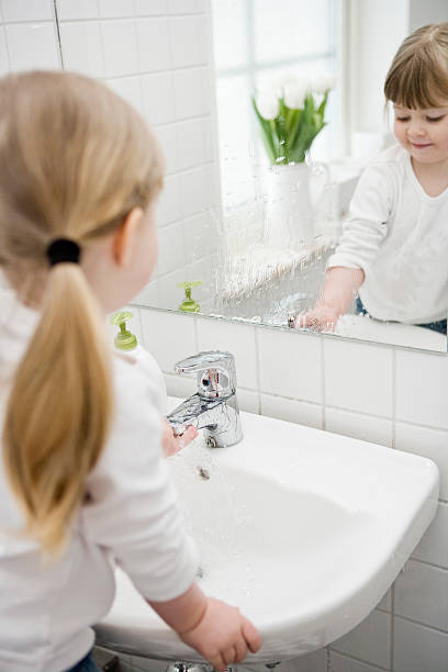 istock Small Girl drinking water 499127305