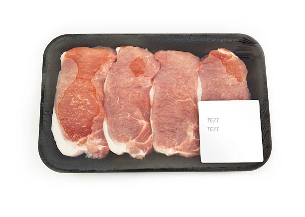 istock raw meat in a package with a sticker 499127918