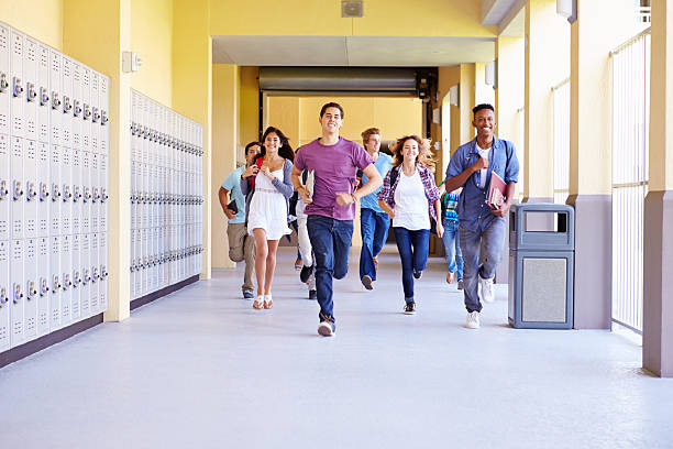 istock Group Of High School Students Running In Corridor 499128133