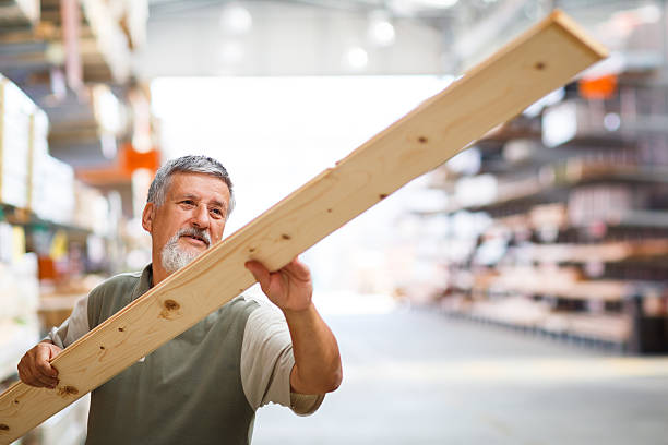 istock Senior man buying construction wood in a  DIY store 499128363