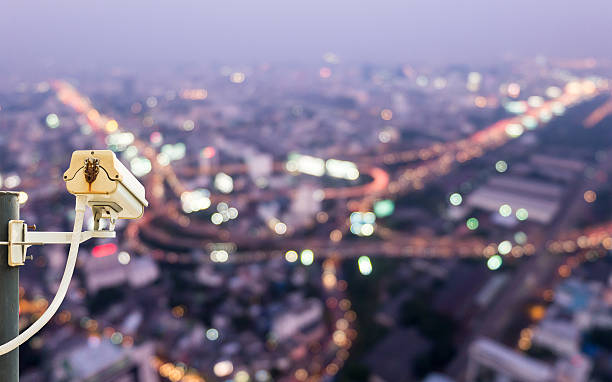 istock CCTV Camera with night city scape on the background 499128435