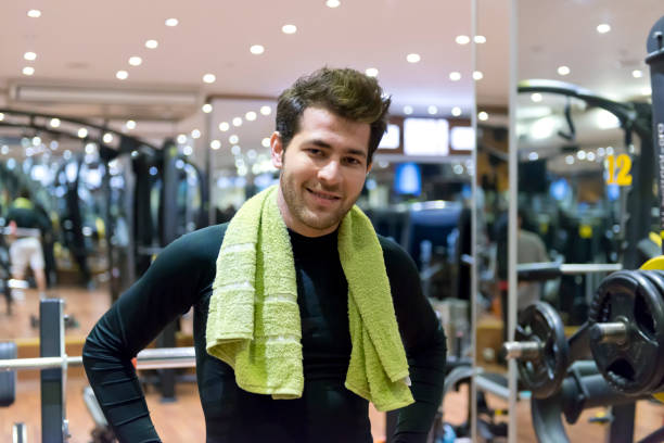 istock Young man posing in fitness center 499130096