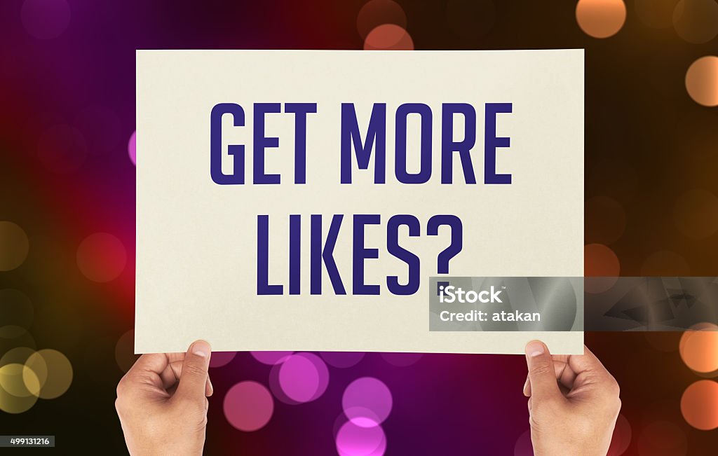 Get More Likes? placard with blurred background Rating Stock Photo