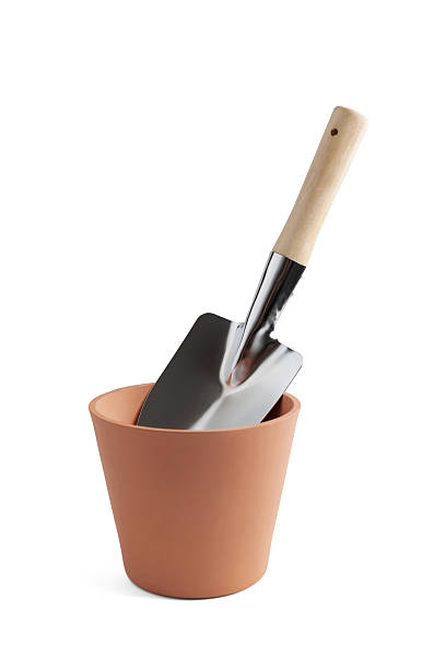 istock Gardening. Garden pot with trowel 499134120