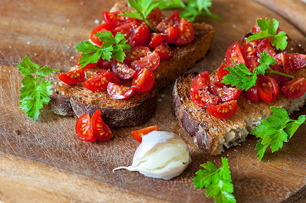 istock Italian bruschetta with cherry tomatoes on whole grain bread 499144580
