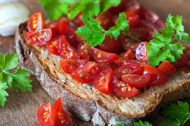 istock Italian bruschetta with cherry tomatoes on whole grain bread 499144776