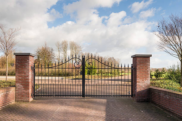 istock Locked iron gate of a new cemetery 499144912