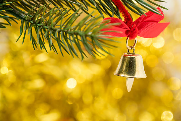 istock Christmas bell ornament hang on tree branch 499144968