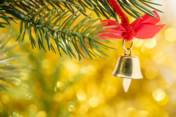 istock Christmas bell ornament hang on tree branch 499145110