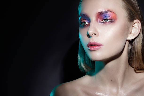 istock beautiful girl with colorful make up 499145372