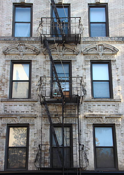 istock Fire Escape Steel Ladder on White Apartment Building Facade 499145382