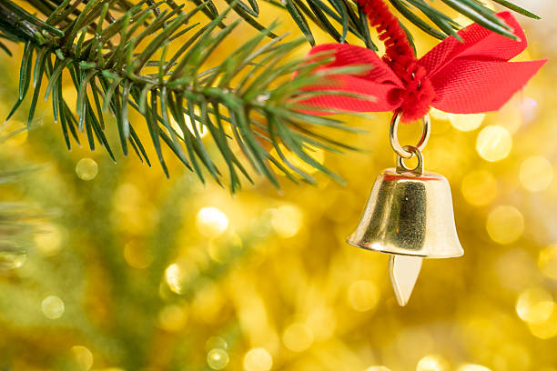 istock Christmas bell ornament hang on tree branch 499145436
