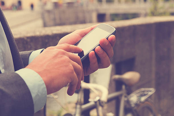 istock Elegant man using cellphone outdoors. 499146222