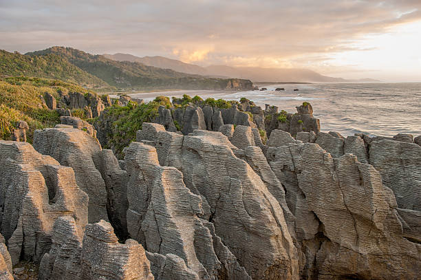 Sunset at Pancake Rocks, South Island, NZ Sunset at Pancake Rocks, South Island, New Zealand punakaiki stock pictures, royalty-free photos & images