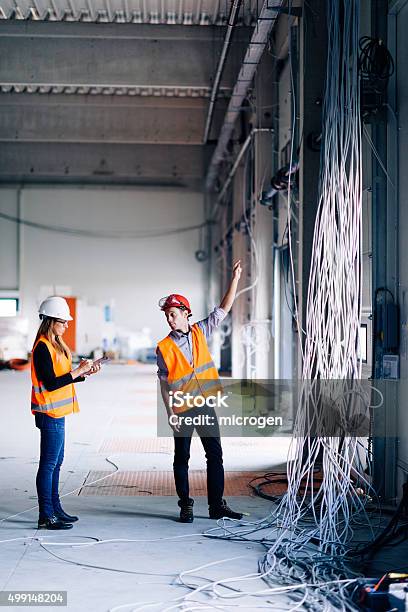 Engineers At Construction Site Stock Photo - Download Image Now - Construction Industry, Construction Site, Building - Activity