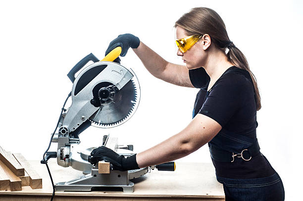 istock woman with a circular disk saw 499148346