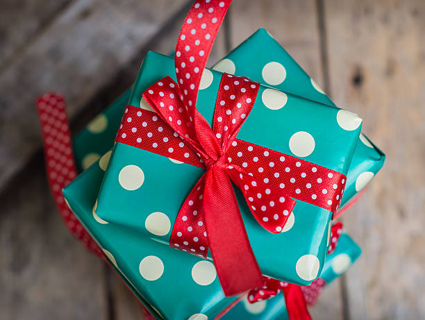istock gifts in a beautiful package on the wooden table 499148600