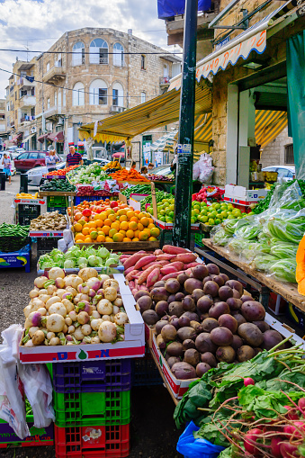 Haifa, Israel - November 28, 2015: Scene of Wadi Nisnas neighbourhood and its market, with local businesses, locals and tourists, in Haifa, Israel