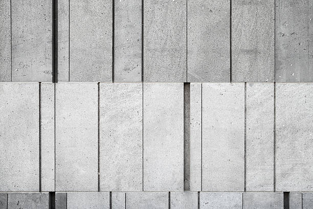 istock Gray concrete wall made of different size blocks 499149614