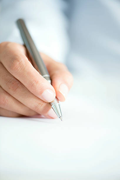 istock Woman Signing Contract Paper 499150920