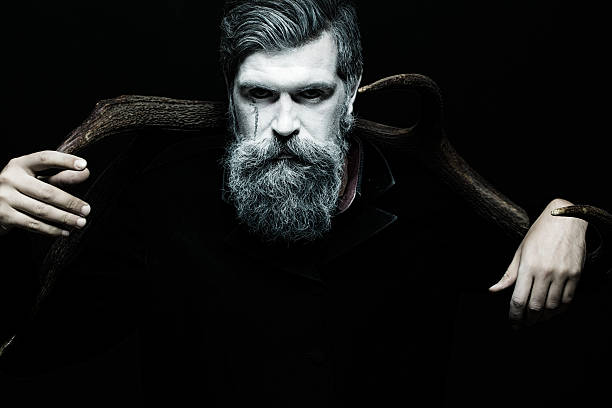 istock Man holding antlers 499151258