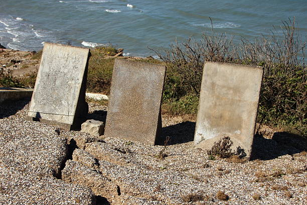 istock Three Headstone at Edge of Cliff with Ocean Background 499152912