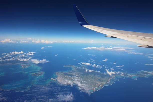 istock Wing of airplane above many islands 499152960