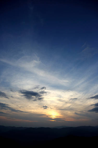 istock juicy sunset in the sky over the mountains 499154376