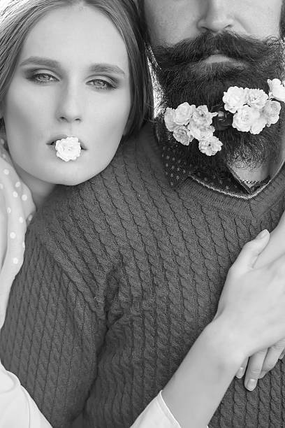 istock Girl and man with flowers on beard 499154978