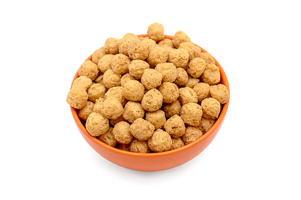 istock Sweet corn balls in orange bowl isolated on white background 499155482
