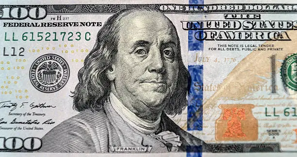 Photo of Close up of new one hundred dollar bill