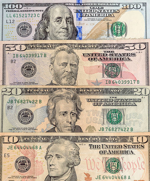 istock ten, twenty, fifty and one hundred dollar bills 499155742