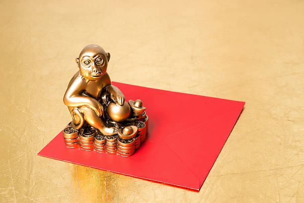 istock Monkey the symbol of the new year 2016 , and red envelope 499155996