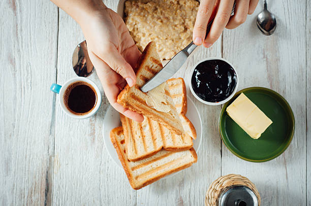 istock Man hands eating toast for breakfast 499156754