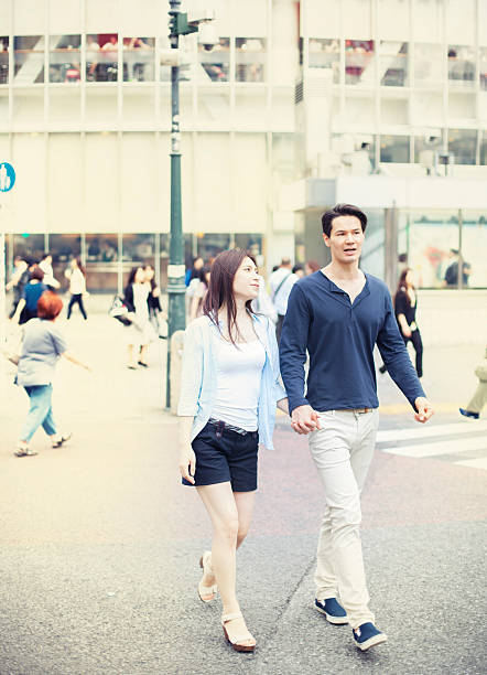 istock Young couple against cityscape background 499156790