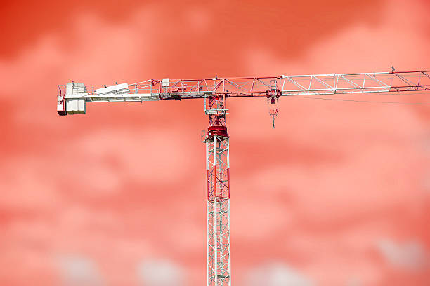 istock Tower crane isolatet on red 499158360
