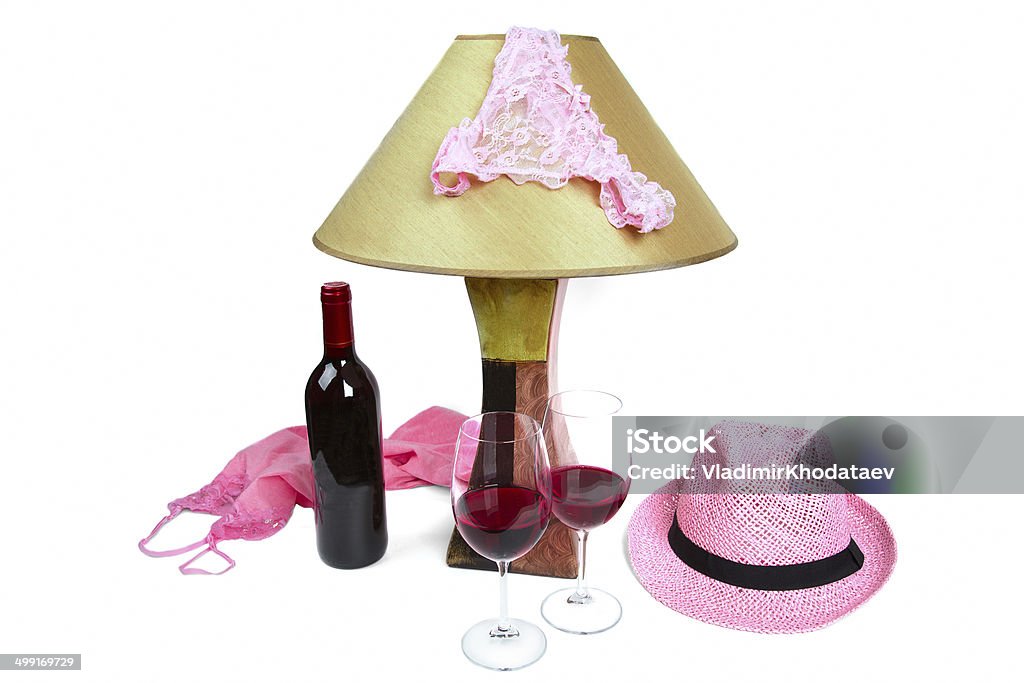 panties on the lamp, bottle of wine and two glasses panties on the lamp near the bottle of wine and two glasses Alcohol - Drink Stock Photo